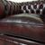 Nuova coppia di poltrone chesterfield club in pelle rosso bordeaux anticato inglese originale 
