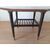 PICCOLO TAVOLINO BASSO MARCHIATO F.G.S. IN TEAK ANNI 50 CON PUNTALI IN MATALLO
