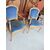 Coppia di poltrone in legno dorato con gambe mosse