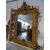 Grande specchiera dorata a foglia scolpita con putti e volute primi 1800 Torino