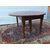 ROUND EXTENDABLE TABLE IN WALNUT, 19th CENTURY. L129xW131xH74 cm. Total extension 370 cm