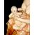 Scultura in ceramica raffigurante madre che allatta bimbo.Manifattura di Guido Cacciapuoti.