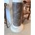 Gray marble column with white marble cherub statue