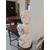 Gray marble column with white marble cherub statue