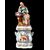 Figurative porcelain veilleuse with lady and floral decoration. France