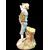 Polychrome majolica sculpture depicting a peasant drinking eggs. Ginori.