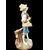 Polychrome majolica sculpture depicting a peasant drinking eggs. Ginori.