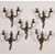 Group of five two-light bronze sconces. 19th century