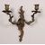 Group of five two-light bronze sconces. 19th century