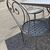 Large handmade wrought iron outdoor table with six chairs. Dimensions: 182 x 112 cm
