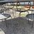 Large handmade wrought iron outdoor table with six chairs. Dimensions: 182 x 112 cm