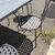 Large handmade wrought iron outdoor table with six chairs. Dimensions: 182 x 112 cm