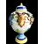 Pair of majolica vases with raised grape vine decoration and leaf motif. Rubbiani manufacture, Sassuolo.