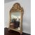 Specchiera in legno intagliato e dorato a foglia. Toscana epoca impero prima metà 800