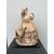 Terracotta sculpture depicting a lady with a dog.Signed (a pupil of Cacciapuoti).     