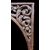 Carved wooden overdoor frieze with a scroll leaf motif.