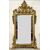 Carved and gilded wooden mirror. Tuscany, early 19th century.