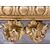 Carved and gilded wooden mirror. Tuscany, early 19th century.