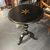 Antique round Tuscan coffee table lacquered in black and gold, painted. Early 1800s. Diameter 57 cm, height 80 cm.