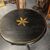 Antique round Tuscan coffee table lacquered in black and gold, painted. Early 1800s. Diameter 57 cm, height 80 cm.