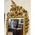 Carved and gilded wooden mirror. Tuscany, early 19th century.