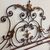 Elegant antique wrought iron double bed headboard. Gold and purple, circa 1930. Dimensions: cm180 . h 155
