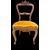 Four walnut chairs carved with rocaille motifs.
