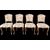 Four walnut chairs with floral pattern carvings.