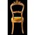 Four walnut chairs carved with rocaille motifs.