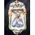 Acquasantiera in maiolica con motivi floreale I putti in rilievo e figura di Cristo al centro.Manifattura di Grottaglie,Puglia.