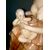 Scultura in ceramica raffigurante madre che allatta bimbo.Manifattura di Guido Cacciapuoti,Milano.