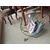 Painted metal log holder in the shape of a swan
