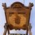 Carved, veneered and inlaid wooden armchair. Italy, 17th-18th century.