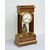 Antique Charles X clock in precious exotic woods. France, 19th century.