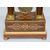 Antique Charles X clock in precious exotic woods. France, 19th century.