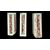 Three architectural elements in marble with a white frame and a variegated red central section.