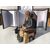Small sculpture in various marbles and hard stones - Seated old man. Probably Russia, 19th-20th century.