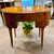 Oval writing desk veneered in walnut and bois de rose - Italy, Louis XVI period.
