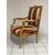 Poltrona Napoleone III in legno intagliato e dorato