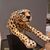 Painted ceramic cheetah with a high-class base: elegance and character
