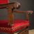Antique Italian walnut armchair with red fabric from 19th century