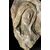 Bassorilievo con volto in pietra - Frammento con segni di usura - XVII secolo