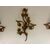 Three gilded metal sconces with floral motifs. 19th century