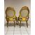 Pair of carved and gilded wooden armchairs. 19th century