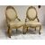 Pair of carved and gilded wooden armchairs. 19th century