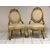 Pair of carved and gilded wooden armchairs. 19th century