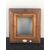 Carved frame in mahogany wood with gilded part.     