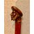 Stick with wooden knob representing a male figure with sideburns and hat.     