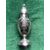 Embossed silver sugar spreader with trophy motifs, masks and floral elements.     