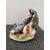 Polychrome porcelain sculpture depicting a caricature character with umbrella and food.Giuseppe Cappe &#39;     